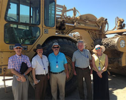 Grand Jurors in front of construction vechicle