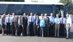 Grand Jurors in front of a bus